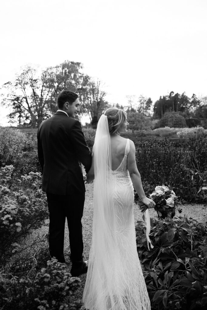 Bride and groom in walled garden at Middleton Lodge