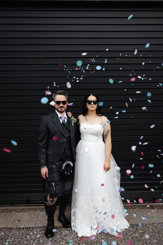 Bride and Groom through confetti at The Engine Works Glasgow