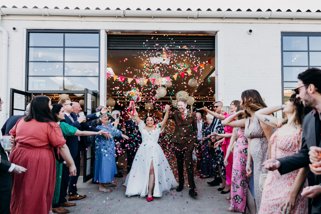 Bride and Groom in colourful confetti at Project House Leeds