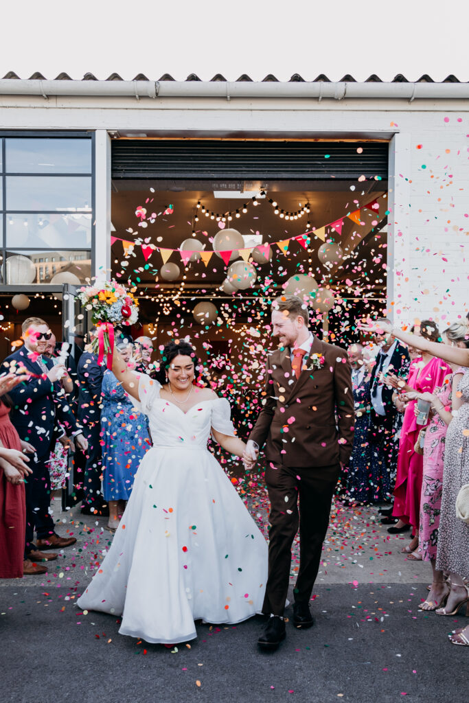 Bride and Groom in colourful confetti at Project House Leeds
