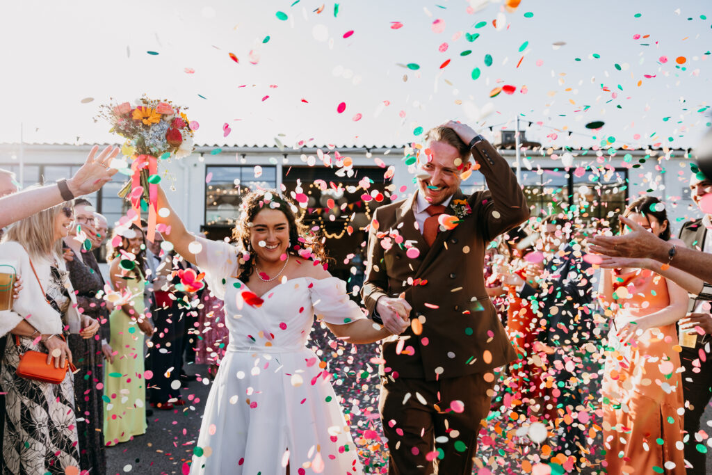 Bride and Groom in colourful confetti at Project House Leeds